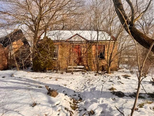 a view of a house covered in snow