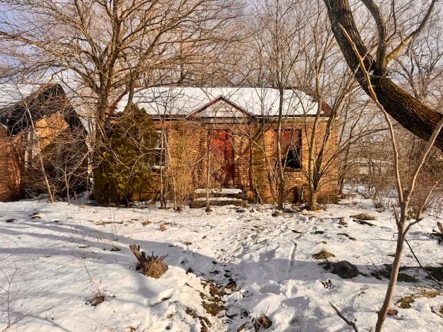 a view of a house covered in snow