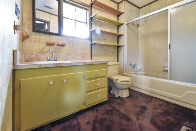 a bathroom with a sink a toilet and a bathtub