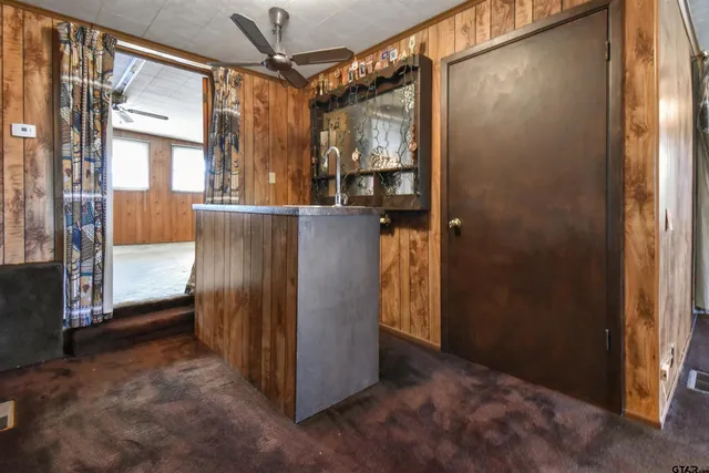a view of a hallway with a glass door