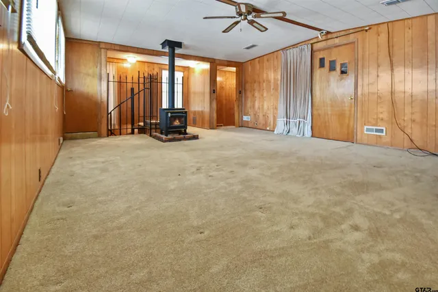 a view of a livingroom with furniture and a window