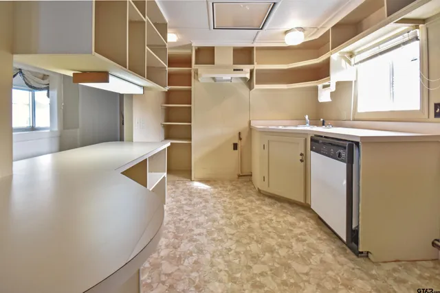 a view of storage and utility room with a window