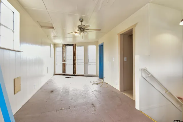 a view of an empty room with a window