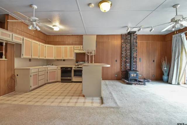 a view of a kitchen with furniture and a window