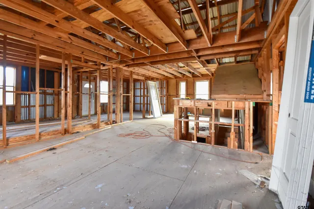 a view of a room with wooden ceiling