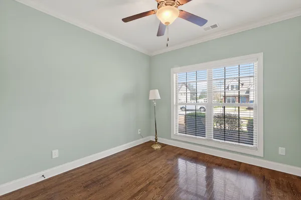 a spacious bathroom with a toilet sink and mirror