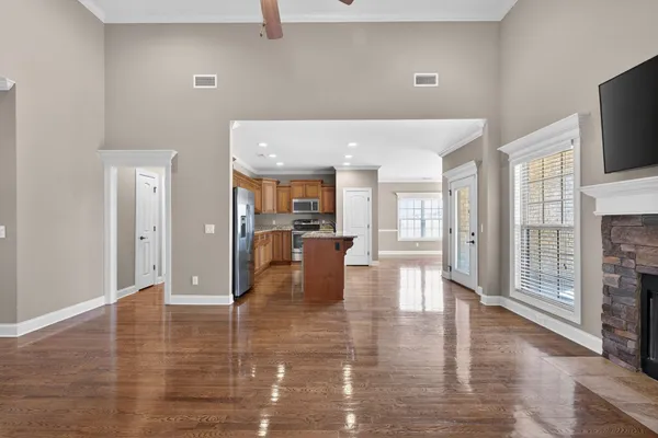 a lobby with furniture and flat screen tv