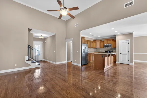 a view of kitchen with cabinets and wooden floor