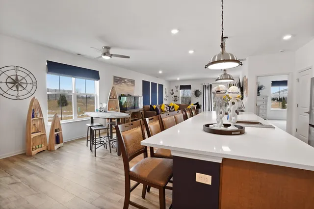 a kitchen with a table and chairs in it