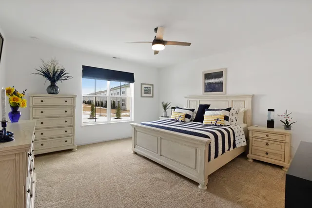 a bed room with a bed and a window