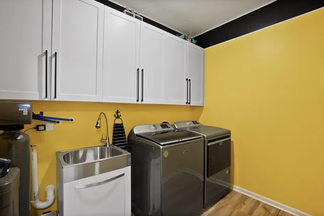 a view of a storage & utility room with a sink