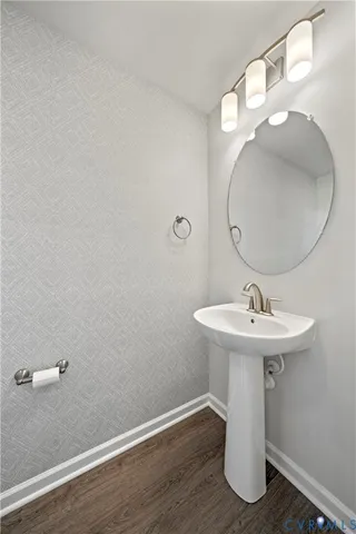 a bathroom with a sink and mirror