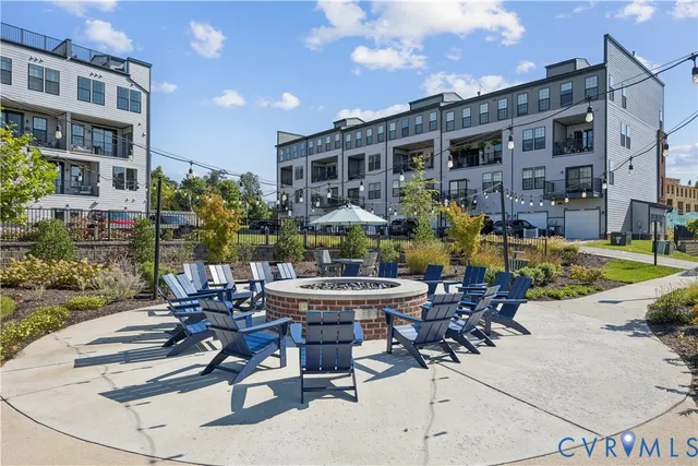 a view of a house with a yard potted plants