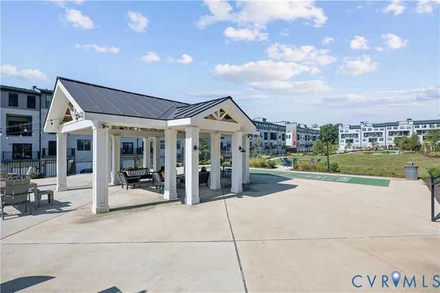 a view of a backyard with a table and chairs