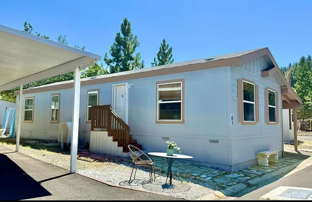 a front view of a house with parking