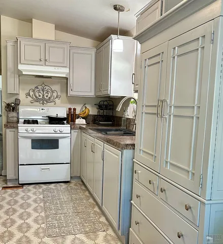 a view of livingroom with washer and dryer