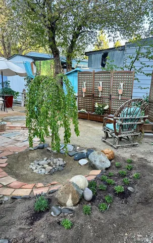 a view of a house with swimming pool yard and outdoor seating