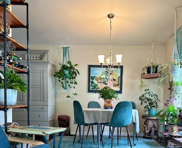 a view of a dining room with furniture and wooden floor