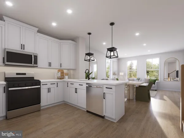 a kitchen with lots of counter top space appliances and cabinets