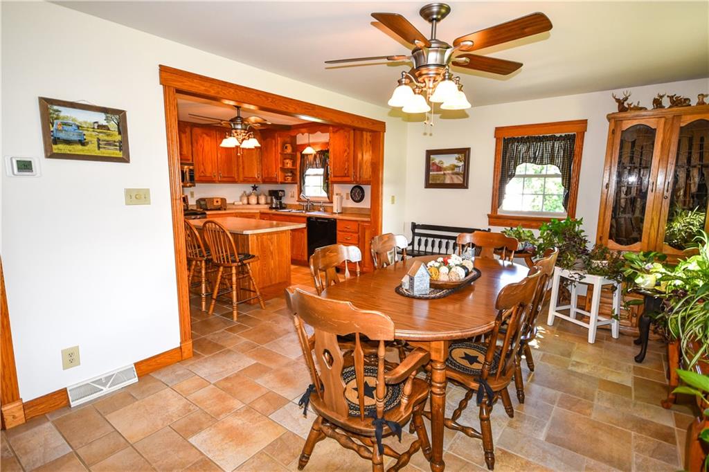 531 White Oak Road Rural Valley, PA 16249 - Photo 15 of 39 a dining room with furniture a rug and a chandelier