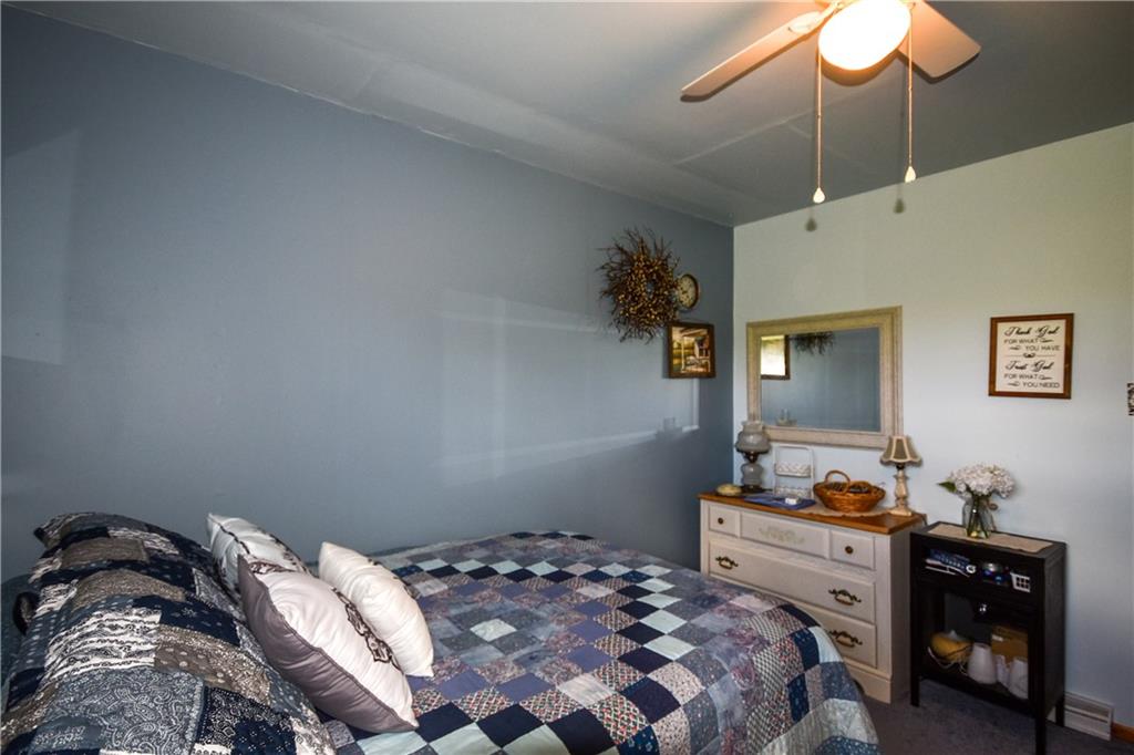 531 White Oak Road Rural Valley, PA 16249 - Photo 17 of 39 a bedroom with a bed and a dresser in it