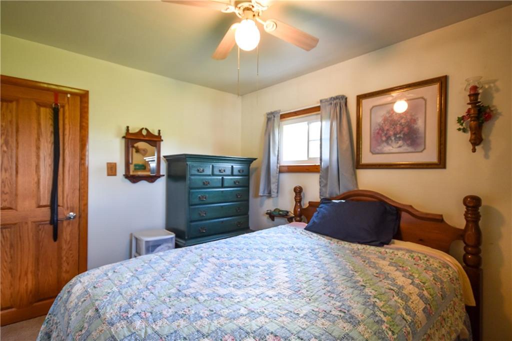 531 White Oak Road Rural Valley, PA 16249 - Photo 20 of 39 a bedroom with a bed and a chandelier