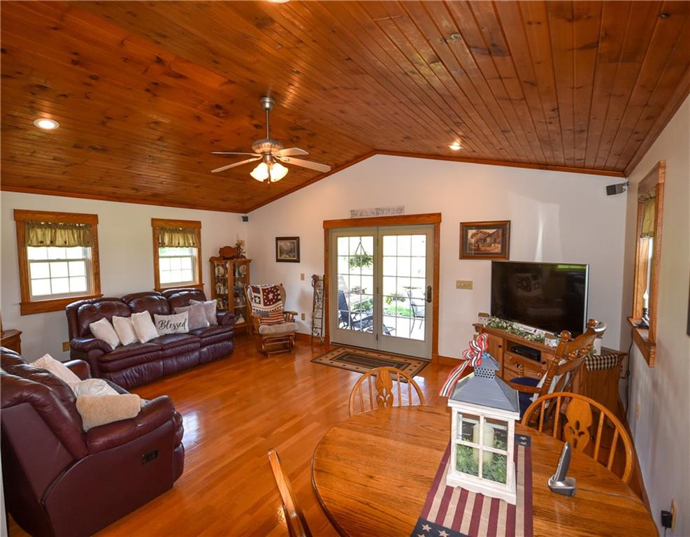 531 White Oak Road Rural Valley, PA 16249 - Photo 2 of 39 a living room with furniture a flat screen tv and a large window