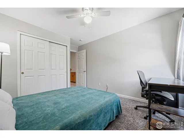 a bathroom with a sink double vanity granite tub shower and a mirror