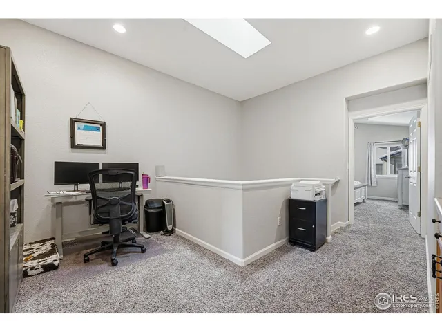 a bedroom with a bed and a television in it