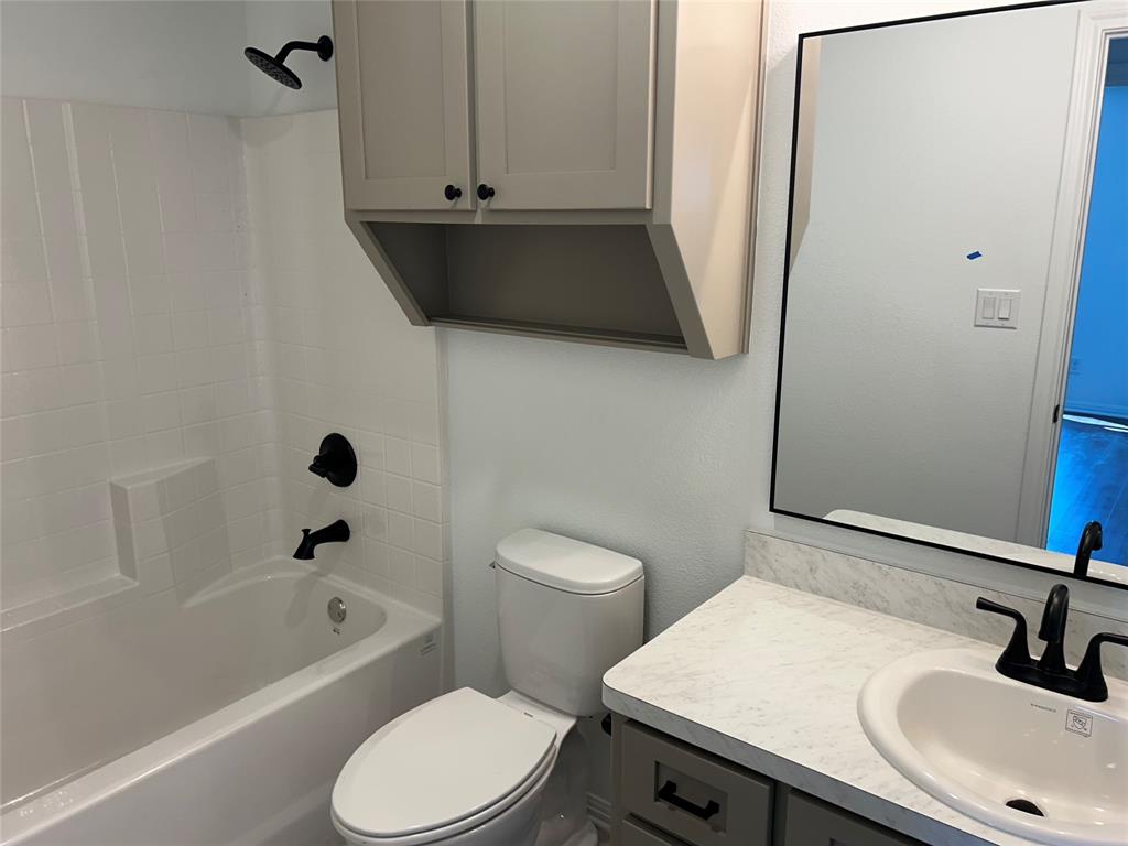 412 Conway Street Waco, TX 76705 - Photo 6 of 8 Bathroom with shower / washtub combination and vanity