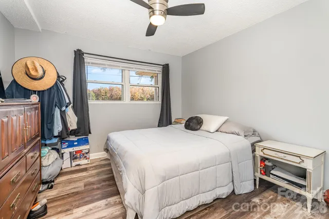 a bathroom with a toilet a sink a mirror a window and mirror