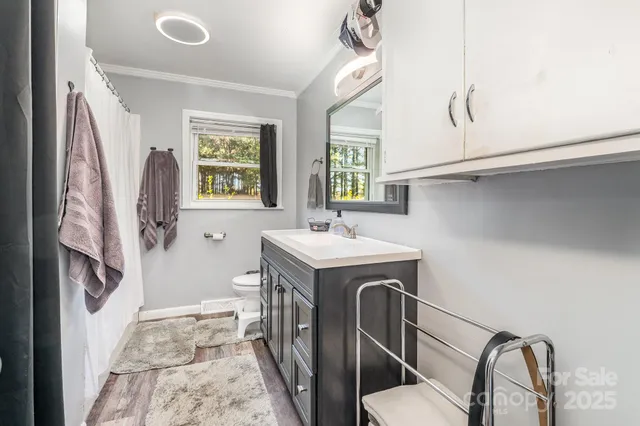a utility room with a sink a washer and dryer