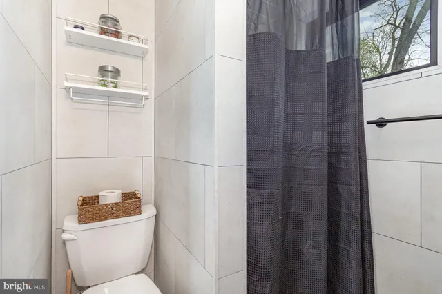 a bathroom with a toilet and a sink