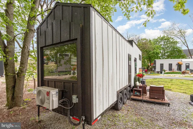 a view of a two chairs in the balcony