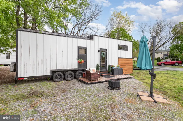 a view of a backyard with a sitting area