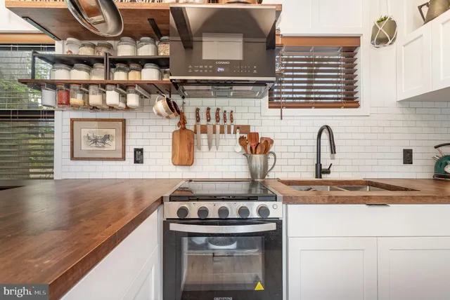 a kitchen with a stove and cabinets