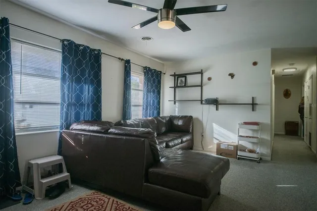 a living room with furniture and a window