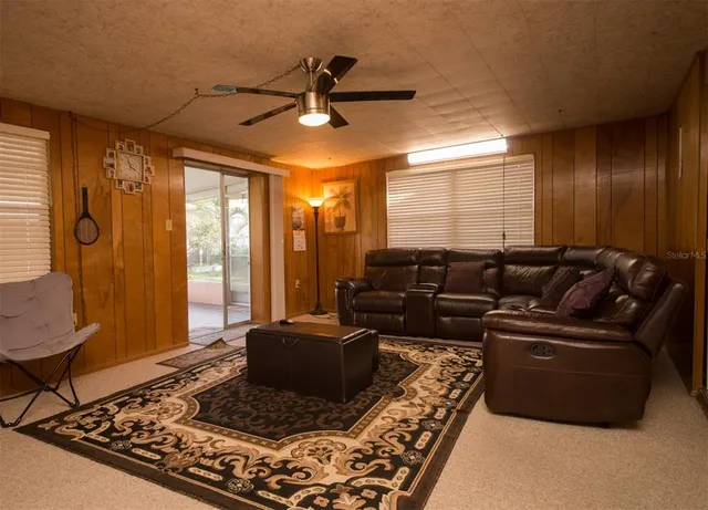 a living room with furniture and a rug