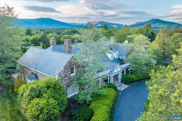 an aerial view of a house with mountain view