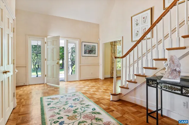 a dining room filled with furniture and wooden floor