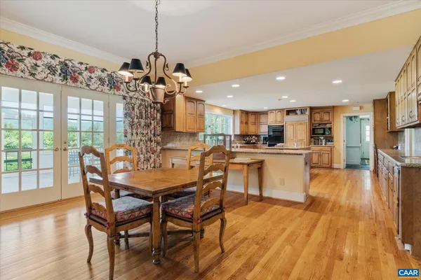 a kitchen with a sink a center island cabinets and stainless steel appliances