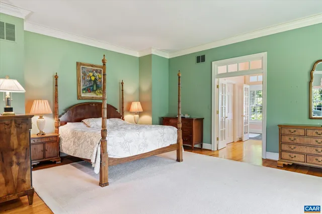 a bedroom with a bed and a couch