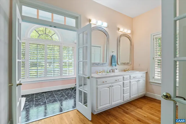 a view of an entryway with wooden floor and windows