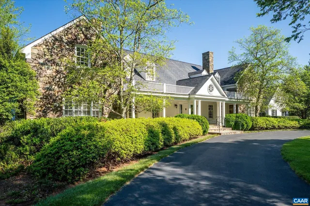 an aerial view of a house with mountain view