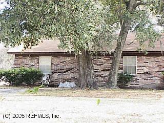 11403 Harts Road Jacksonville, FL 32218 - Photo 1 of 1 front view of a house with a street