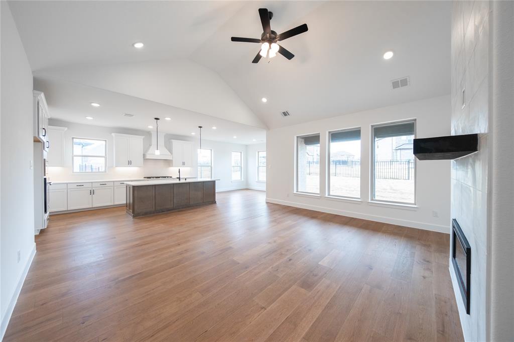 2715 Triumph Court Heath, TX 75126 - Photo 6 of 30 a view of a kitchen with a sink and wooden floor