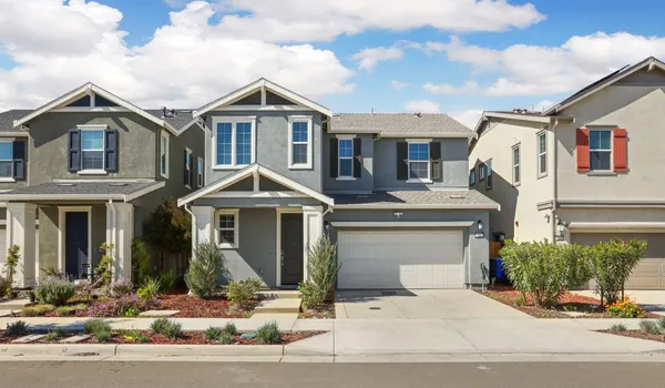 a front view of a house with garage