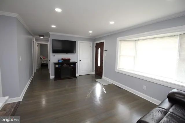 a view of kitchen with stove and cabinets