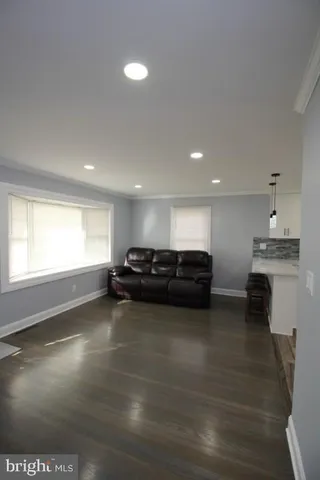 a kitchen with a sink stove cabinets and refrigerator