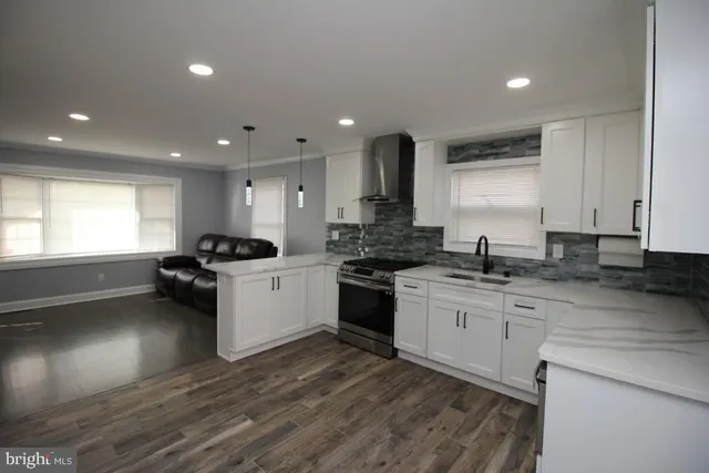a kitchen with a white cabinets and white appliances